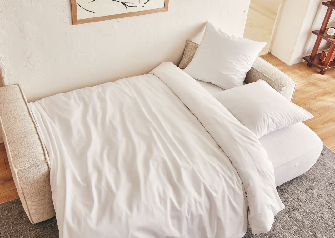 Folia beige avec accoudoirs déplié