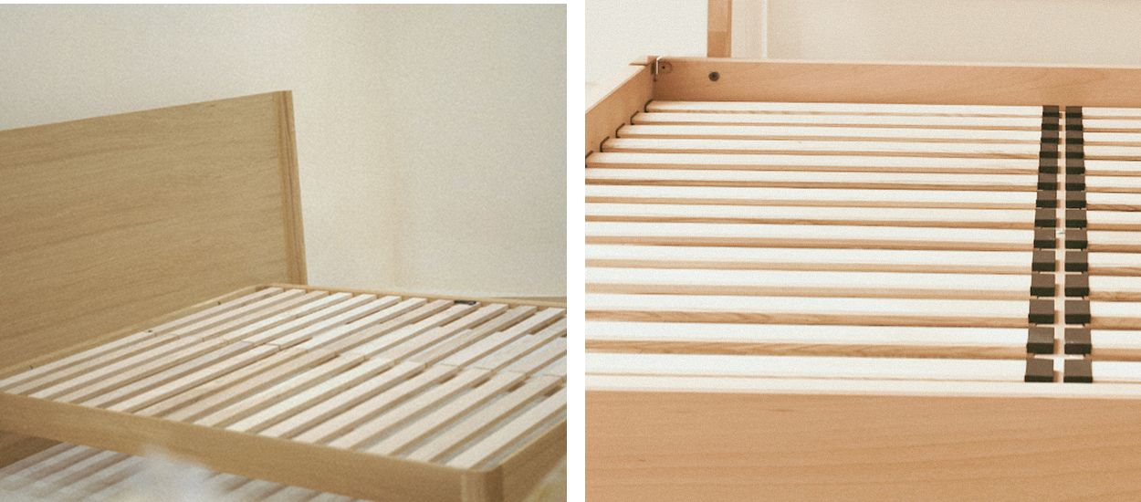 Gros plan sur des lattes en bois rigides et souples montrant la structure d’un sommier à lattes et la ventilation sous le matelas.